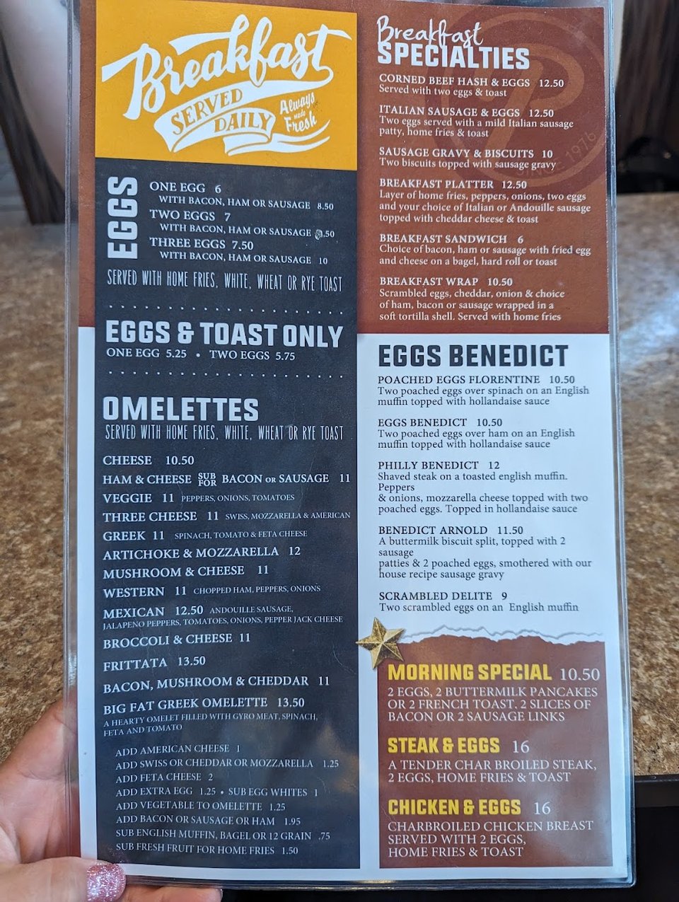 Printed menu beside a coffee cup.